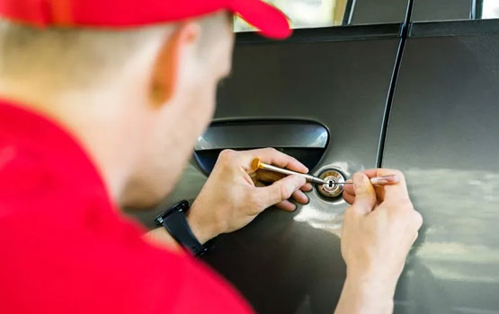 Locksmith unlocking a car door during an emergency lockout in Brownwood TX